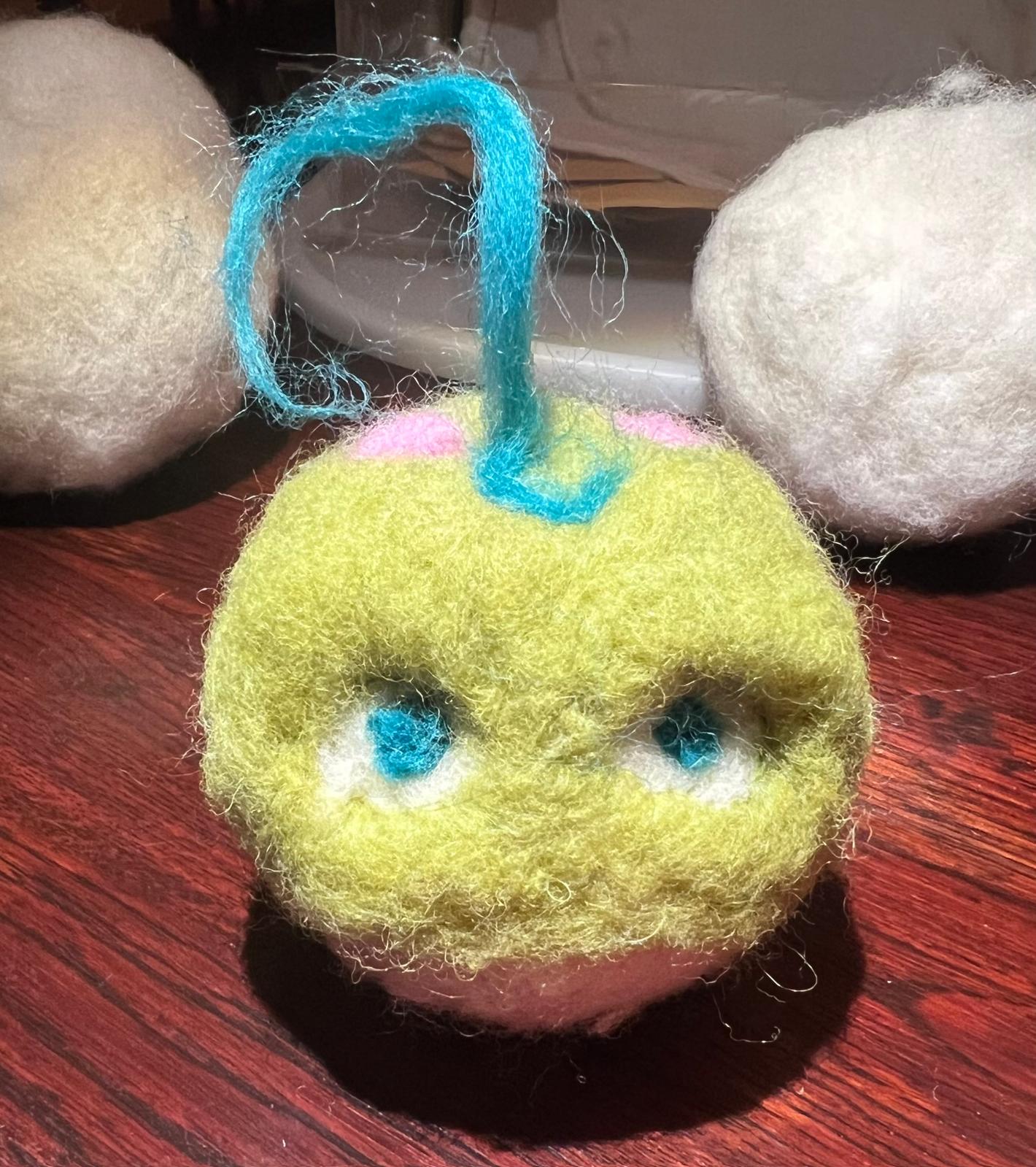 dryer ball made to look like a little green monster