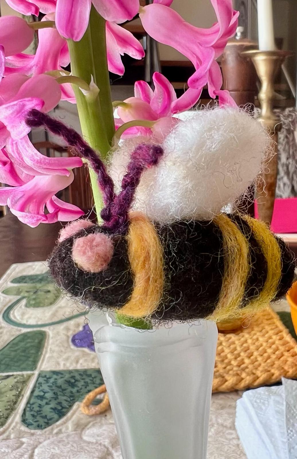 Hand made bee sculpture made of wool from the farm.